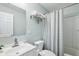 Clean bathroom with a shower-tub combo, large mirror, and modern vanity at 3261 Lowndes St, Atlanta, GA 30337