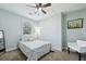 A comfortable bedroom with a patterned quilt and neutral walls at 3261 Lowndes St, Atlanta, GA 30337