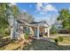 Charming brick house with a covered front porch and well-manicured landscaping at 3261 Lowndes St, Atlanta, GA 30337
