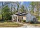 Charming home featuring a welcoming front porch, wooden deck, and a well-manicured lawn at 3261 Lowndes St, Atlanta, GA 30337