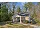 A quaint brick house with a charming front porch and stairs to the backyard at 3261 Lowndes St, Atlanta, GA 30337