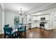 Bright kitchen with white cabinets, stainless steel appliances, and adjacent dining area at 3261 Lowndes St, Atlanta, GA 30337