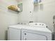 Bright laundry room featuring a modern white washer and dryer at 3261 Lowndes St, Atlanta, GA 30337