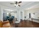 Bright living space with hardwood floors, ceiling fan, and view of kitchen and dining areas at 3261 Lowndes St, Atlanta, GA 30337