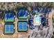 Aerial view of the tennis courts, pool, and clubhouse surrounded by lush greenery at 39 Telfair Ct, Acworth, GA 30101