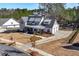 Expansive home featuring a long driveway, lush lawn, and privacy fencing at 39 Telfair Ct, Acworth, GA 30101