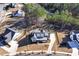 Aerial view of a suburban home surrounded by trees and manicured lawns at 39 Telfair Ct, Acworth, GA 30101