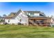 A spacious backyard and screened-in porch highlight the house's exterior at 39 Telfair Ct, Acworth, GA 30101