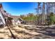 The house includes a backyard with a screened porch, lush greenery, and a fenced perimeter at 39 Telfair Ct, Acworth, GA 30101