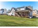 A large backyard and screened-in porch accentuates the house's charm at 39 Telfair Ct, Acworth, GA 30101
