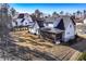 View of a beautifully landscaped backyard with a screened porch and partial fencing at 39 Telfair Ct, Acworth, GA 30101