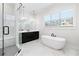 Spa-like bathroom with marble floors, a sleek soaking tub, and a glass-enclosed shower at 39 Telfair Ct, Acworth, GA 30101