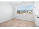 Bright bedroom with large window offering natural light and views of the landscaped yard at 39 Telfair Ct, Acworth, GA 30101