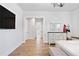Bright, open bedroom with wood flooring and a full view to the Primary bath at 39 Telfair Ct, Acworth, GA 30101