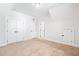 Spacious bedroom with carpet, featuring multiple closets and white walls at 39 Telfair Ct, Acworth, GA 30101