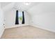 An airy bedroom featuring carpeted floors, white walls, and a window with black curtains at 39 Telfair Ct, Acworth, GA 30101