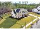 Beautiful home with a well-kept lawn, covered porch, and lush landscaping at 39 Telfair Ct, Acworth, GA 30101