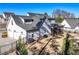 View of a modern home featuring a three-car garage, screened porch, and well-maintained lawn at 39 Telfair Ct, Acworth, GA 30101
