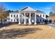 Stately building featuring a grand entrance with columns and flags on a manicured lawn at 39 Telfair Ct, Acworth, GA 30101