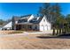 Gorgeous home featuring a three-car garage, covered front porch, and beautifully landscaped yard at 39 Telfair Ct, Acworth, GA 30101