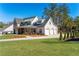 Charming home with manicured lawn, covered porch, and convenient three-car garage at 39 Telfair Ct, Acworth, GA 30101