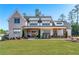 Beautiful home with a large front yard, covered porch, and classic architectural details at 39 Telfair Ct, Acworth, GA 30101