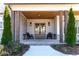 Charming front porch with rocking chairs, a wood ceiling and meticulously manicured shrubs at 39 Telfair Ct, Acworth, GA 30101
