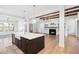 Open concept kitchen with hardwood floors and an island sink facing the living room fireplace at 39 Telfair Ct, Acworth, GA 30101