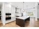 Modern kitchen featuring an island with seating, stainless steel appliances, and white cabinets at 39 Telfair Ct, Acworth, GA 30101
