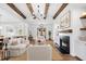 Inviting living room featuring exposed beams, a fireplace, and abundant natural light at 39 Telfair Ct, Acworth, GA 30101