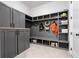 Spacious mudroom featuring custom shelving, storage cabinets, and tile flooring for organization at 39 Telfair Ct, Acworth, GA 30101