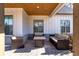 Covered patio furnished with comfortable seating and a rustic coffee table at 39 Telfair Ct, Acworth, GA 30101