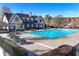 Community pool with lounge area and clubhouse in a beautiful setting at 39 Telfair Ct, Acworth, GA 30101