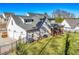 Backyard view of home with spacious yard, screened porch, and attached three-car garage at 39 Telfair Ct, Acworth, GA 30101