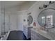 Beautiful bathroom with dual vanities, stand alone shower, and eye-catching, geometric tile flooring at 610 Summertree Se Ct, Smyrna, GA 30126