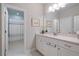 Bright bathroom featuring a white vanity, modern fixtures, and a connecting shower/bath area at 10570 Grandview Sq, Johns Creek, GA 30097