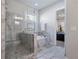 Elegant bathroom featuring a glass shower, soaking tub, and marble accents at 10570 Grandview Sq, Johns Creek, GA 30097