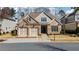 Lovely home boasting a brick front, attached two-car garage, and manicured lawn at 10570 Grandview Sq, Johns Creek, GA 30097