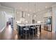 Bright kitchen boasts a large island with seating, stainless steel appliances, and hardwood floors at 10570 Grandview Sq, Johns Creek, GA 30097