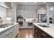 Modern kitchen featuring stainless steel appliances, light countertops, and ample cabinet space at 10570 Grandview Sq, Johns Creek, GA 30097