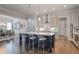Elegant kitchen with an island, stainless steel appliances, and adjacent dining area at 10570 Grandview Sq, Johns Creek, GA 30097
