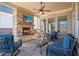 Relaxing outdoor living space featuring brick fireplace and comfortable seating at 10570 Grandview Sq, Johns Creek, GA 30097