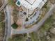 Birds-eye view of the building, entrance, parking lot, and surrounding roads and greenery at 1501 Clairmont Rd # 1027, Decatur, GA 30033