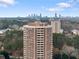 Aerial view of the building showcasing the skyline in the background and surrounding greenery at 1501 Clairmont Rd # 1027, Decatur, GA 30033