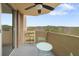 Balcony featuring outdoor seating, a garden stand with flowers, and beautiful tree-lined views at 1501 Clairmont Rd # 1027, Decatur, GA 30033