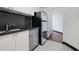Modern kitchen featuring stainless steel appliances, sleek countertops, and a stylish tiled floor at 1501 Clairmont Rd # 1027, Decatur, GA 30033