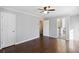 Bedroom with hardwood floors, view to the bathroom and walk-in closet, as well as recessed lighting at 3911 Ivy Ne Rd, Atlanta, GA 30342