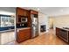 Kitchen with stainless steel appliances, tile floors, and a cozy fireplace at 3911 Ivy Ne Rd, Atlanta, GA 30342