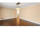 Open living space with hardwood floors and a modern chandelier at 3911 Ivy Ne Rd, Atlanta, GA 30342