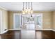 Spacious living room with hardwood floors and a modern chandelier at 3911 Ivy Ne Rd, Atlanta, GA 30342